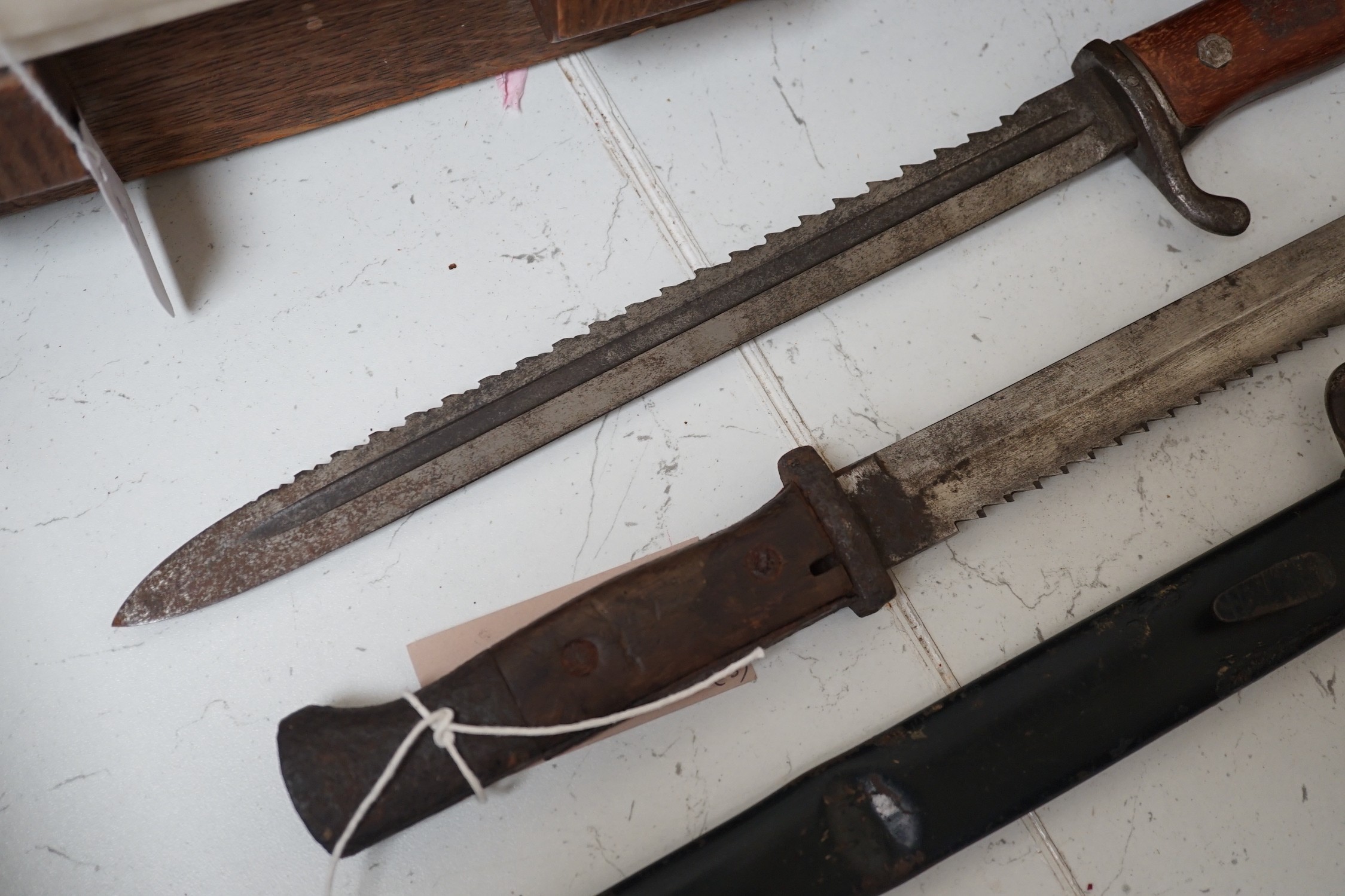 Three German bayonets including two saw-back pioneers
